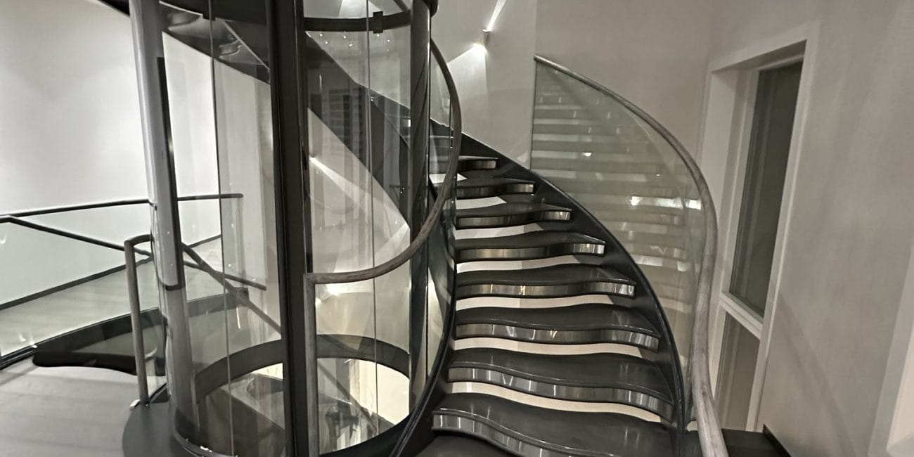 The Piccadilly staircase, designed by V.P Stairs Ltd, brings dynamic elegance to commercial atriums with its helical form and expert craftsmanship.