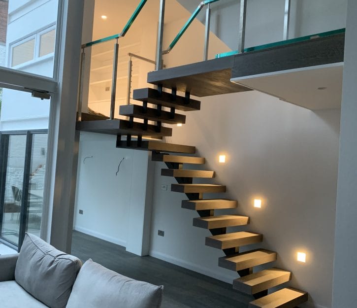 Luxurious spinal staircase with cable balustrades, designed in a contemporary style that seamlessly blends into its environment for a striking architectural effect.