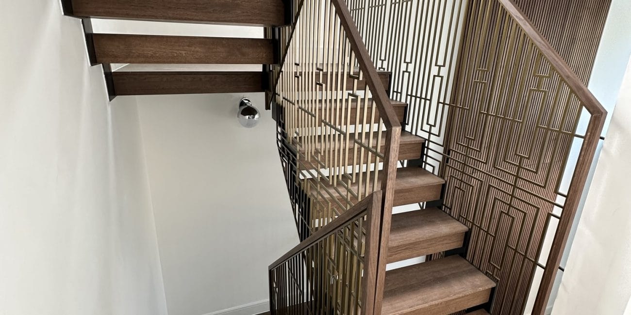 V.P Stairs Ltd specializes in luxury zig-zag staircases with walnut steps and stainless-coated metal balustrades, perfect for any high-end renovation.