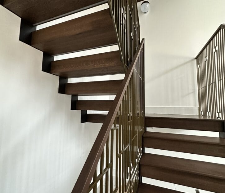 UK's finest craftsmanship shines in the Woodford staircase, a stunning blend of natural oak and modern steel.