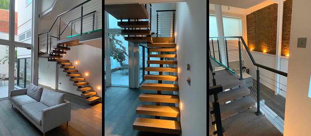 Spine staircase with cherry wood steps, cable balustrades, and aluminium handrails.