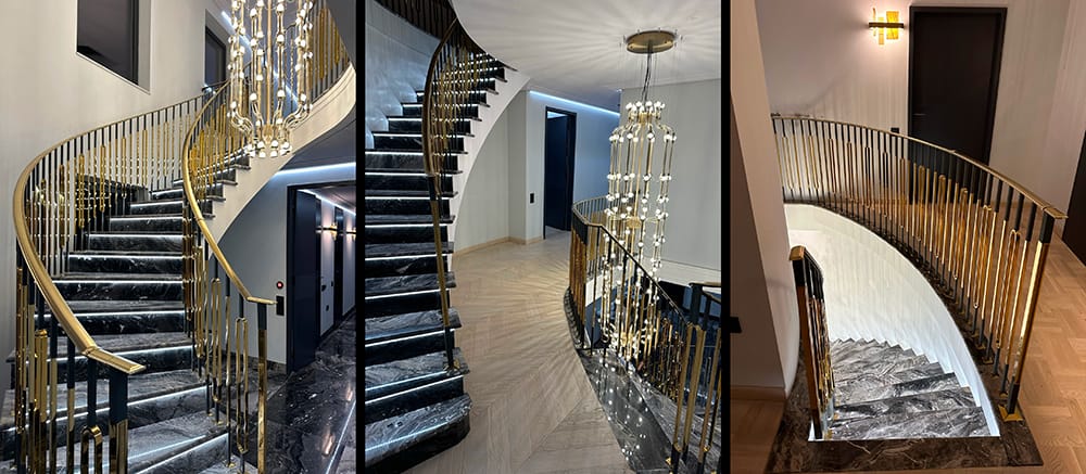 Luxurious spiral staircase with marble steps, LED lighting, and gold-finished metal balustrades.