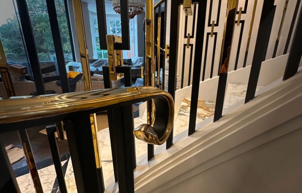 Electroplated brass balustrade with patinated finish in classic home