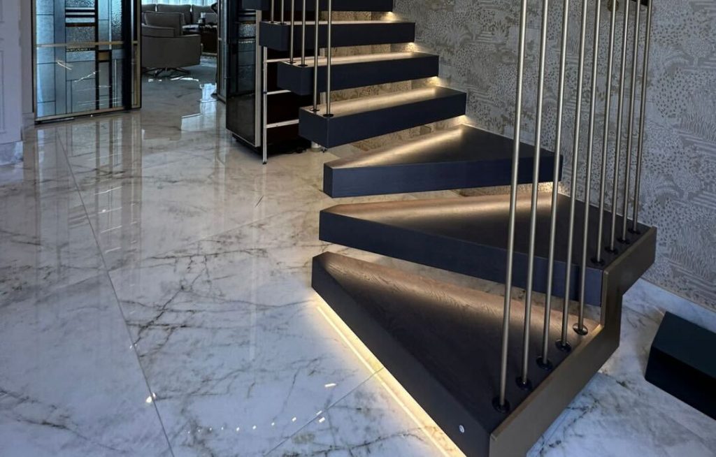 Modern staircase with integrated LED lighting along steps and handrails