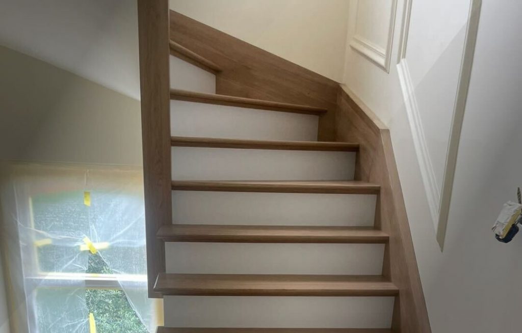 Modern floating staircase with oak wooden cladding