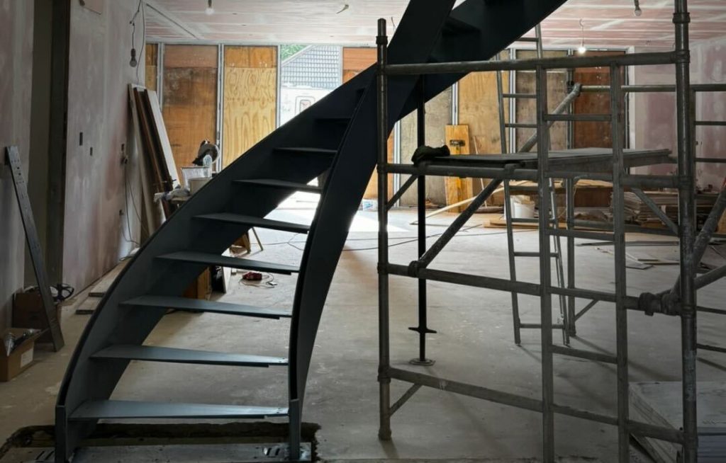Metal staircase frame prepared for spray painting