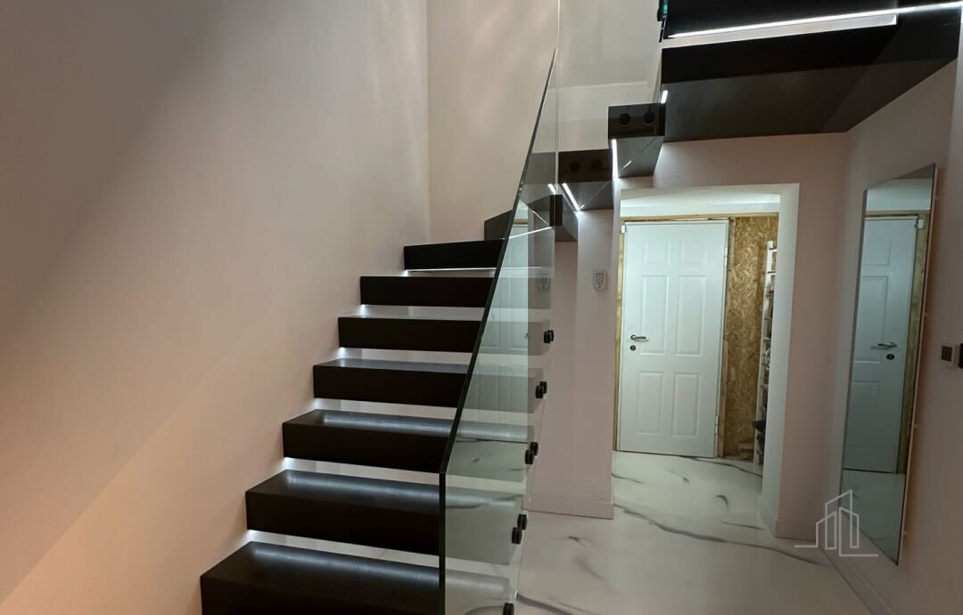 floating staircase with wooden cladding