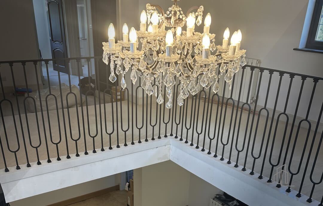 Christmas decorations on a wooden helical staircase with garlands