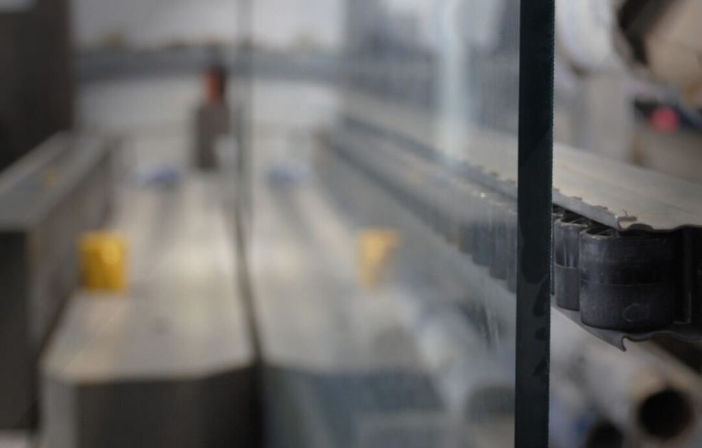 Modern staircase with laminated glass balustrade and steel details