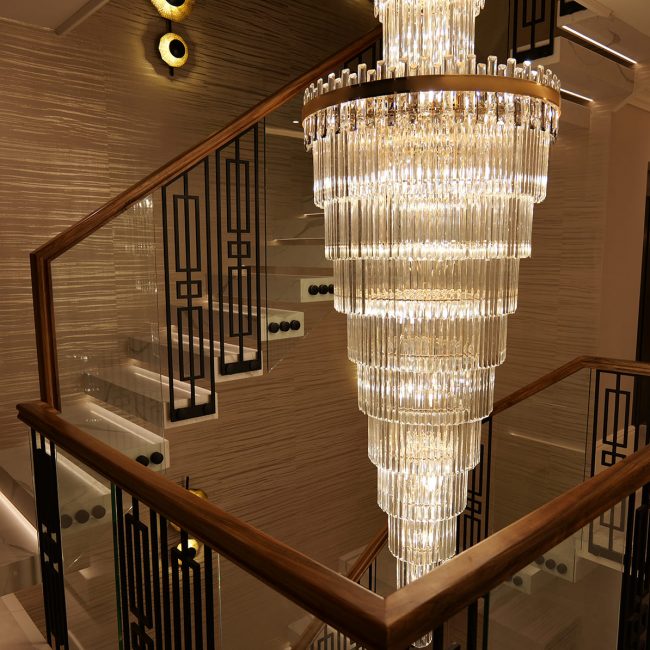 Floating staircase Peckham by V.PSTAIRS — white quartz treads, glass balustrade and walnut handrail in modern home interior