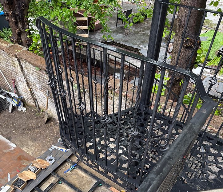 Garden metal staircase with mahogany decking steps
