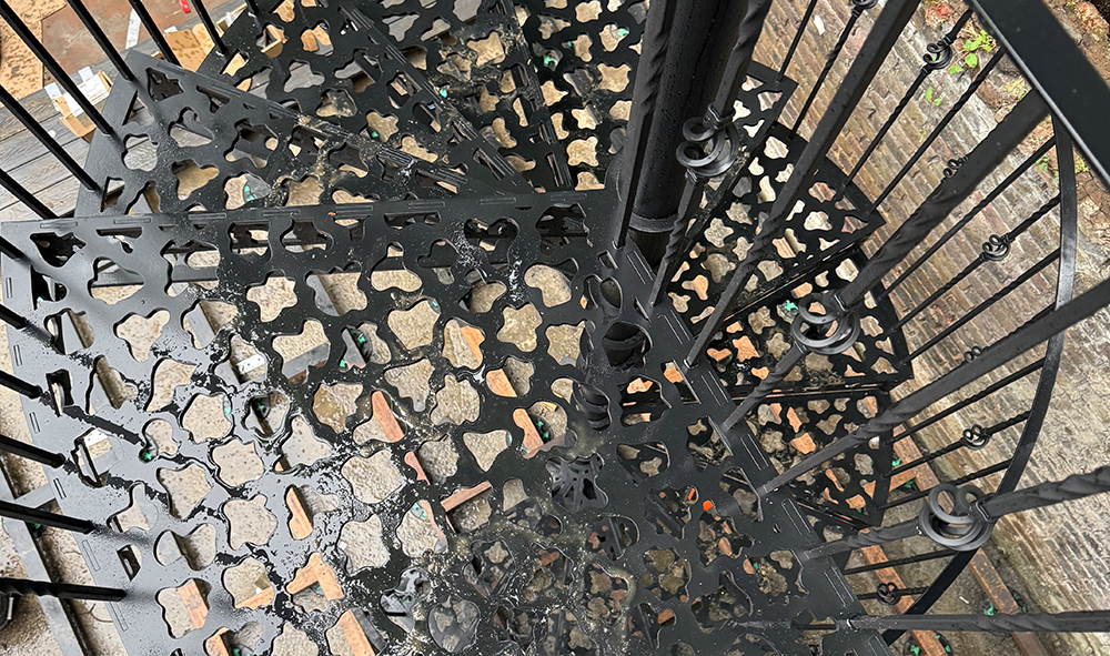 Space-saving outdoor metal staircase for small garden