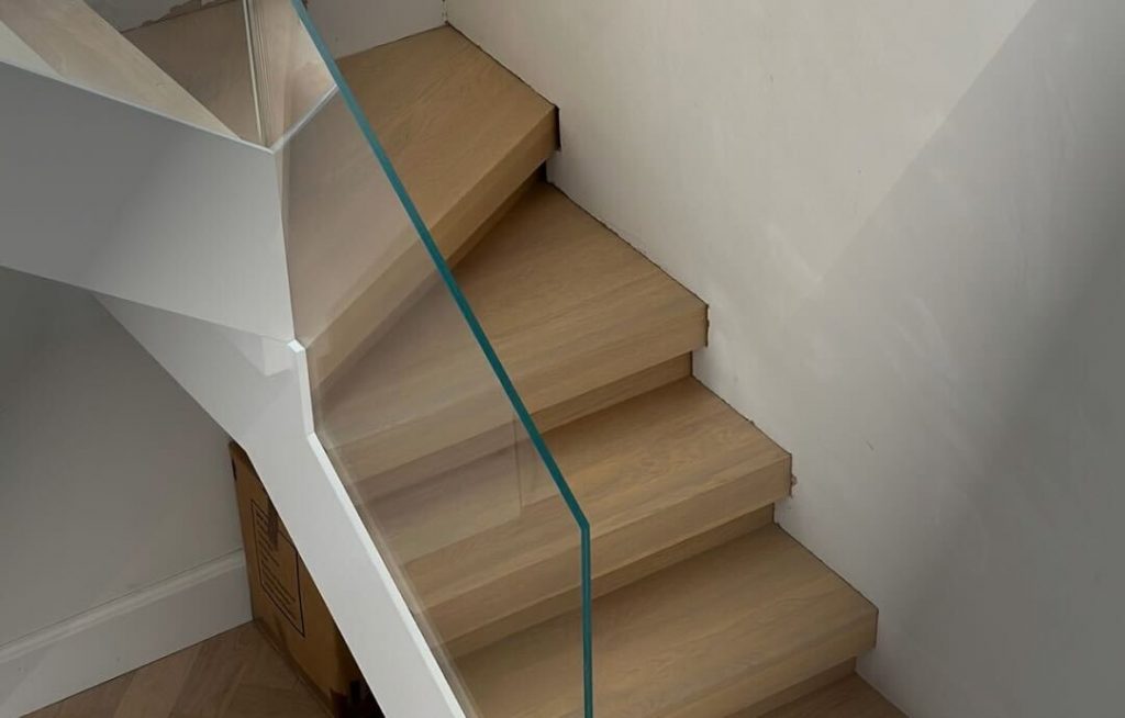 combining glass and wood for metal frame staircase