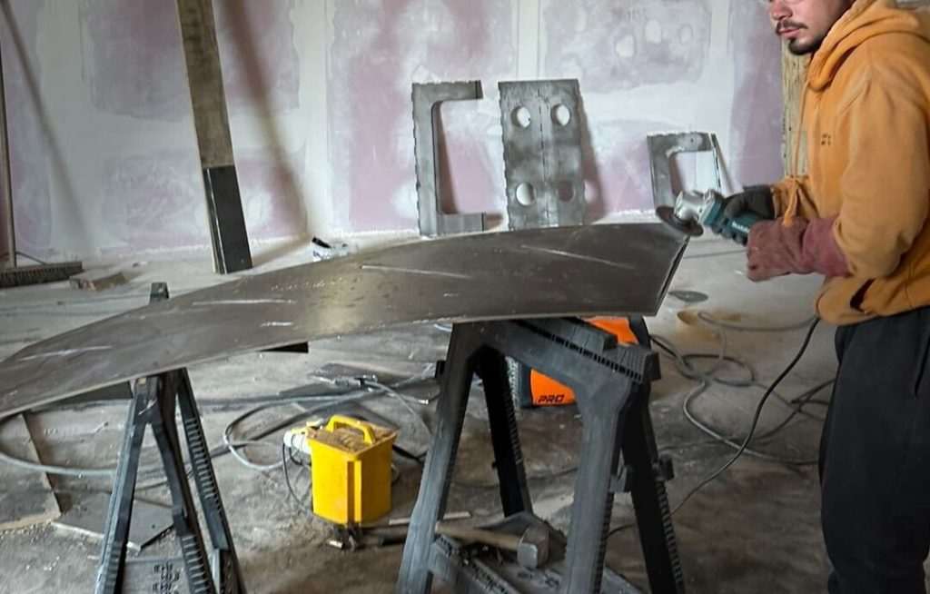 Professional processing of sheet metal for use in the installation of a custom staircase in the UK