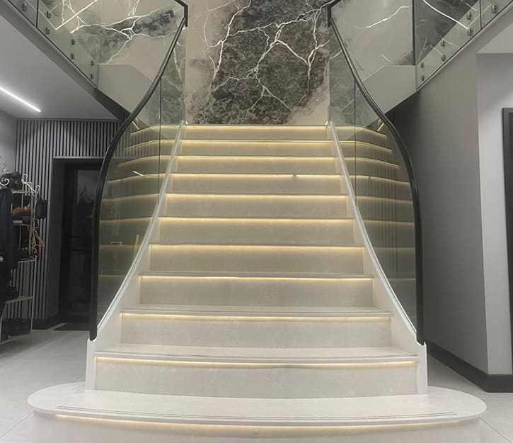 Open stringer metal staircase with marble steps London
