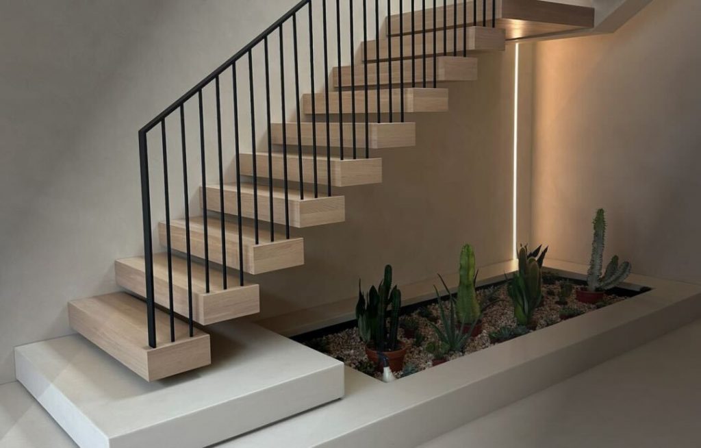 The Eastbourne staircase by V.PSTAIRS and its effectively used under-stair space with decorative design