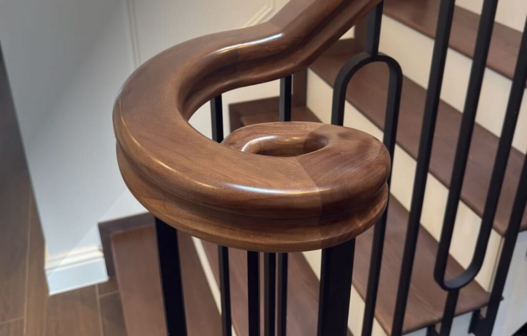 A high-quality wooden handrail, seen from close up