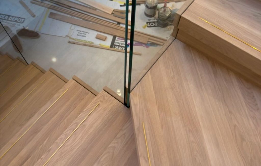 Finishing the steps on a newly constructed staircase