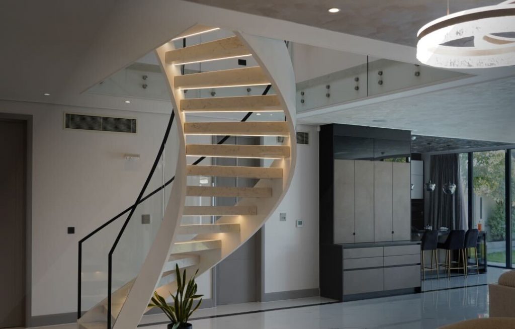 A helical staircase with a tempered glass balustrade