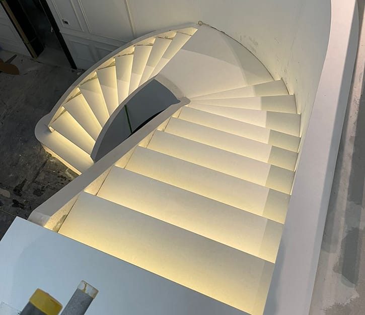 custom curved staircase built on steel frame with floating appearance