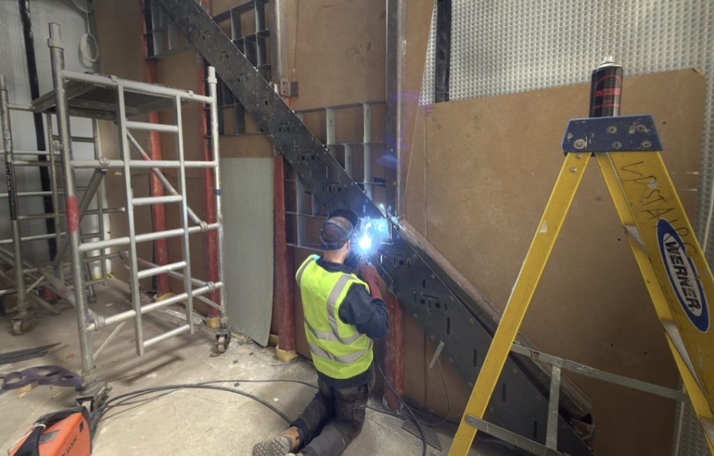 Metal staircase fixing plate installed before underfloor heating system