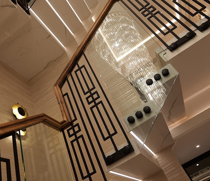 Bespoke geometric metal balustrade with glass panels and walnut handrail